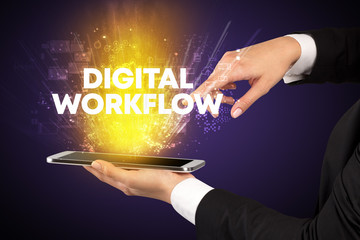 Close-up of a touchscreen with DIGITAL WORKFLOW inscription, innovative technology concept