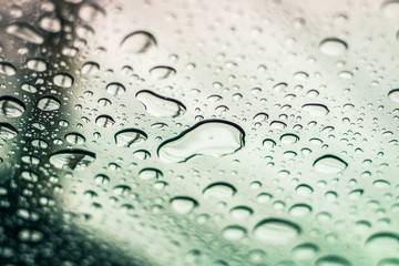 Water drops on glass of car sunroof with copy space. 