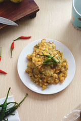 Bakwan Jagung Indonesia traditional snack food or fritter corn taste sweet serve with green chili