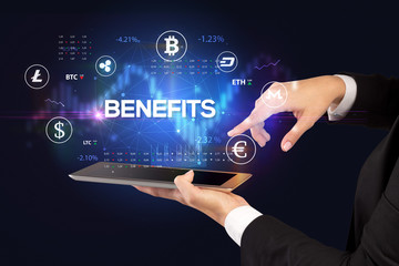 Close-up of a touchscreen with BENEFITS inscription, business opportunity concept
