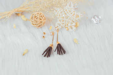 Pearl tassel earrings and accessories.These are earrings we made ourselves.Pearl earrings.Black fringed decoration.Noble and elegant.The earrings are made of metal and the color is like gold.