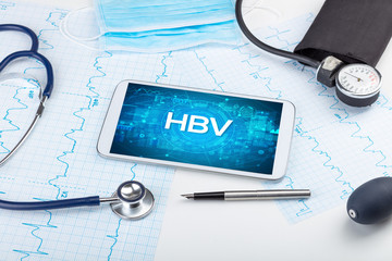 Close-up view of a tablet pc with HBV abbreviation, medical concept