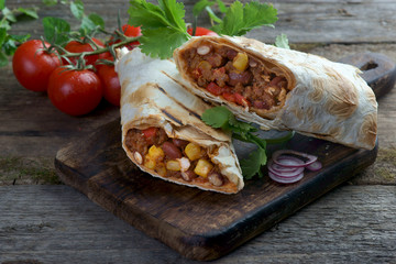 burritos on a wooden background