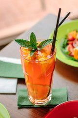 Fresh lemonade with citrus fruits and mint.