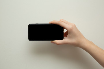 Female hand with mobile phone 
