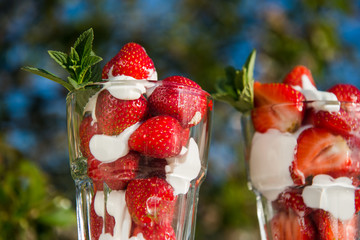 Fresh strawberries with yoghurt and whipped cream. Breakfast time. Healthy food. Delicious dessert sugar free. Vegetarian dish. Spring time 