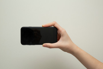 Female hand with mobile phone 
