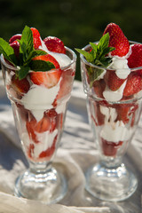 Fresh strawberries with yoghurt and whipped cream. Breakfast time. Healthy food. Delicious dessert sugar free. Vegetarian dish. Spring time 