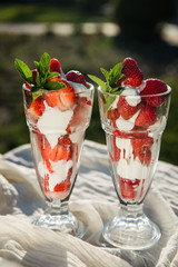 Fresh strawberries with yoghurt and whipped cream. Breakfast time. Healthy food. Delicious dessert sugar free. Vegetarian dish. Spring time 