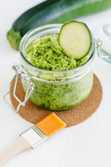 Grated zucchini in a glass jar - natural diy facial mask. Homemade cosmetics and spa recipe.