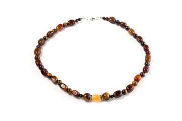 beads from a natural Tiger eye, Carnelian on a white background isolate