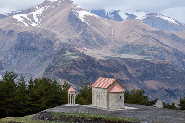 Fototapeta na wymiar Beautiful scenery of Kazbegi valley view from Ioane Natlismcemeli church, Caucasus mountain range in Georgia