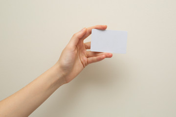 Woman hand holding white card