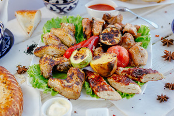 Meat plate - grilled kebabs from chiken meat, with grilled vegetables.