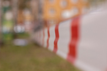 A white and red ribbon prohibits entry to the Playground. Playground swing in the open air...