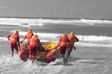 rescue crew launching inflatable boat