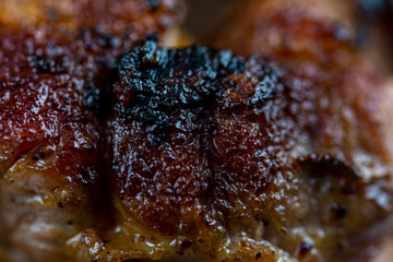 Macro on a juicy, delicious beef steak cooked in a frying pan