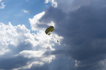Summer season activity. Glider flying over dramatic clouds. Brela, Croatia