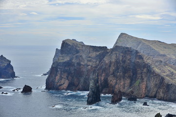 Fototapeta na wymiar The rocky shores of Madeira Island in the Atlantic Ocean.