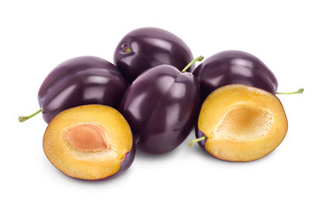 fresh purple plum and half with leaves isolated on white background with clipping path and full depth of field