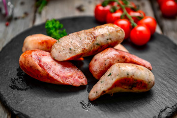 grilled sausages on a wooden table