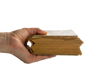 A woman holds an old book on a white background