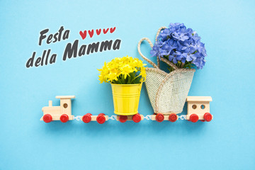 Happy Mother day text in italian  Love Greeting Card - children's train toy carries a bouquet of flowers