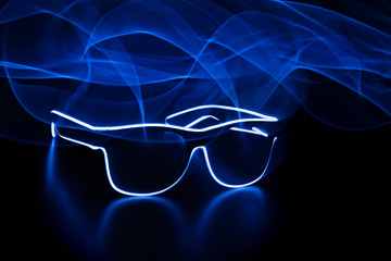 luminous neon lines. glasses. black background, motion effect