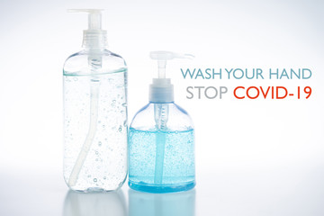 Close up hand sanitizer gel pump bottle, alcohol gel for prevention coronavirus disease, bacteria and germ with wash your hand stop COVID-19 text
