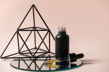 Glass bottle with pipette and formula of anti aging serum