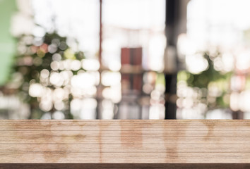 3D Rendering, Wooden top table with bokeh light effect and blur restaurant on background, blur background