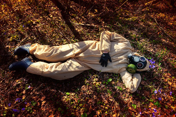 man in protective suit, mask in forest