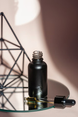 Glass bottle with facial anti aging oil in pipette