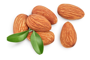 Obraz na płótnie Canvas Almonds nuts with leaves isolated on white background with clipping path and full depth of field. Top view. Flat lay.