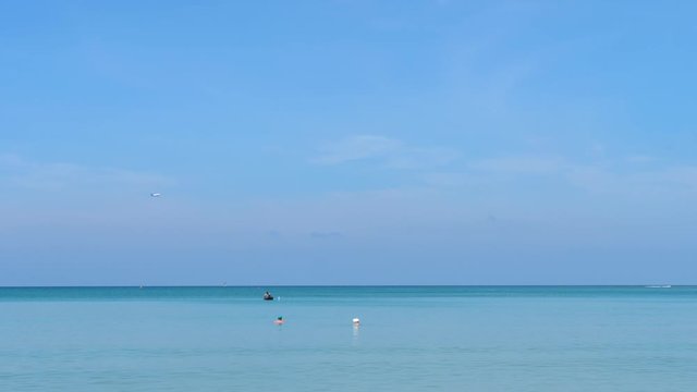 Airplane approaching over ocean