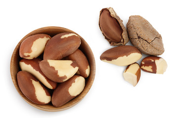 Brasil nuts in wooden bowl isolated on white background with clipping path and full depth of field. Top view. Flat lay