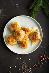 Top view of plate with meatballs, scattered pepper and fresh dill. Served dinner concept