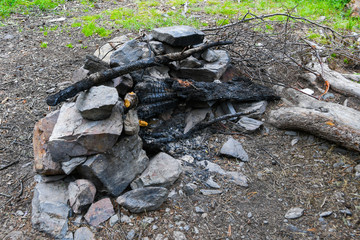 hearth of stones for tourist campfire in campsite, outdoor recreation