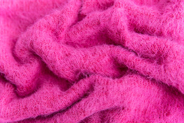 Woolen texture background, knitted wool fabric, pink hairy fluffy textile