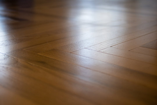 Glare from the window on the parquet floor
