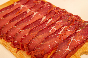 Turkish bacon, pastrami ( kayseri pastirma ) on white background