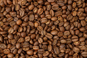 Aromatic roasted coffee beans background. Texture top view.