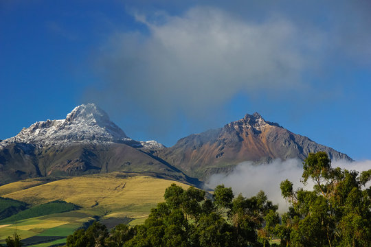 ILINIZA VOLCANO, ECUADOR - DECEMBER 03, 2019: View towards the peaks of the mountain emerging from the mist
