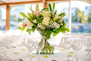 bright tropical bouquet on a sunny wedding table 