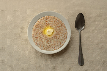 Barley porridge for Breakfast. Breakfast plate on the table with a tablecloth