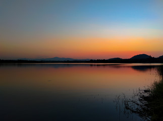 Sunset over the reservoir in Thailand