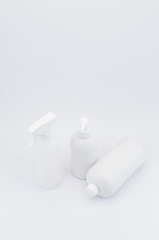 white plastic bottles on a white background