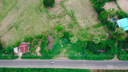 Obraz na płótnie Canvas Aerial view of green fields and farmlands in rural Thailand.