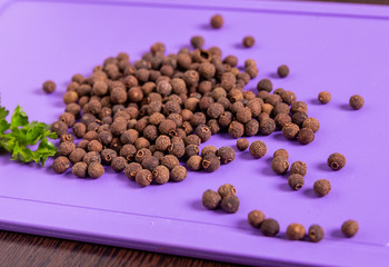 Black pepper and parsley on the table.