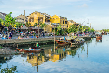 Naklejka na ściany i meble Panorama Aerial view of Hoi An ancient town, UNESCO world heritage, at Quang Nam province. Vietnam. Hoi An is one of the most popular destinations in Vietnam. Boat on Hoai river